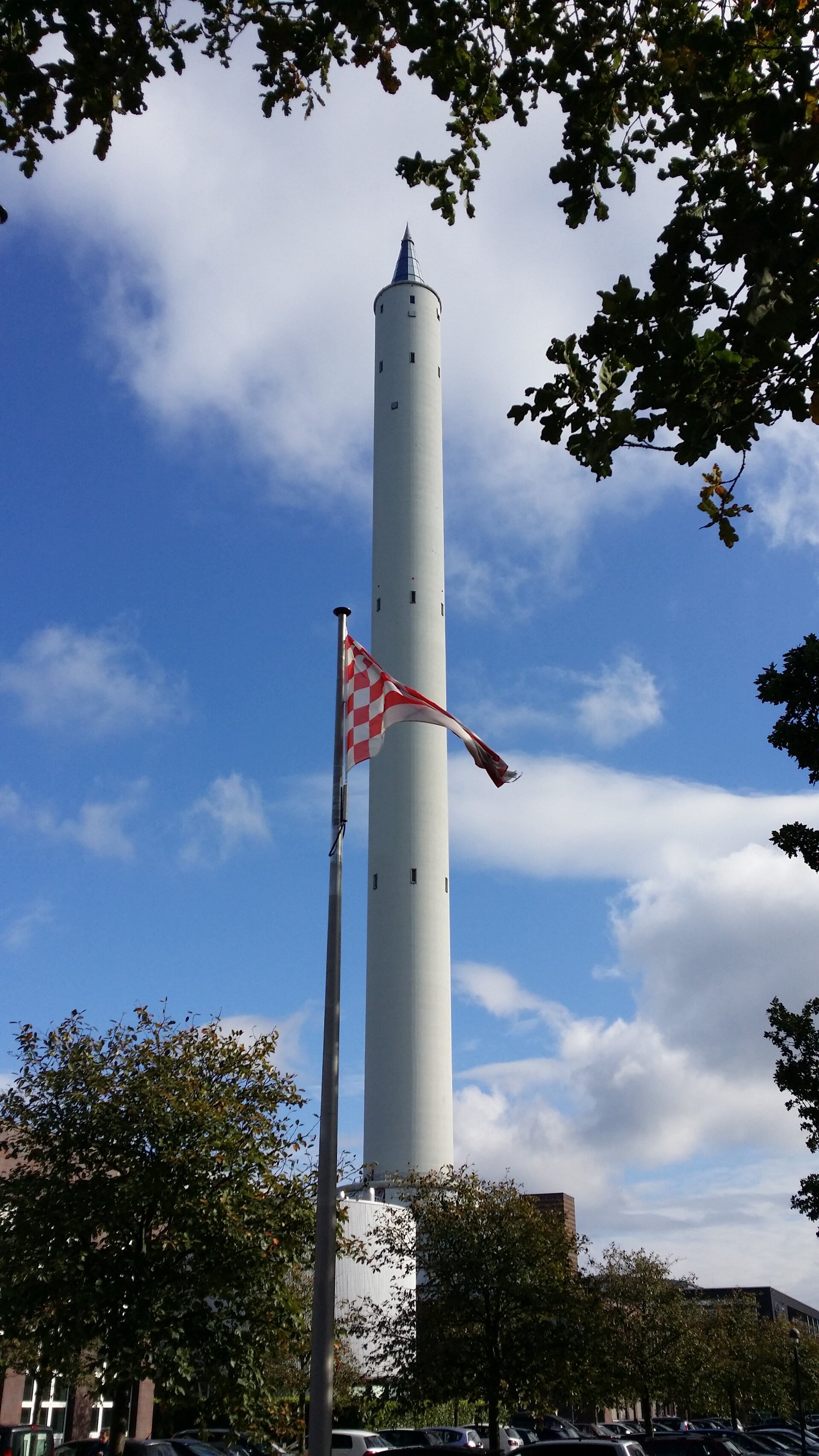 The ZARM Drop Tower behind the flag of Bremen